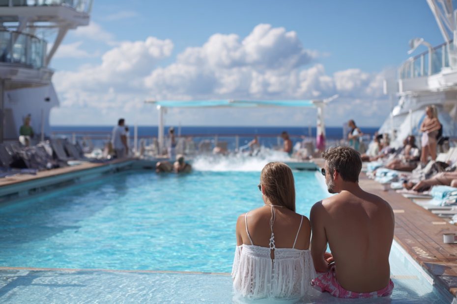 Couple relaxing on a sea day aboard a Virgin Voyages cruise