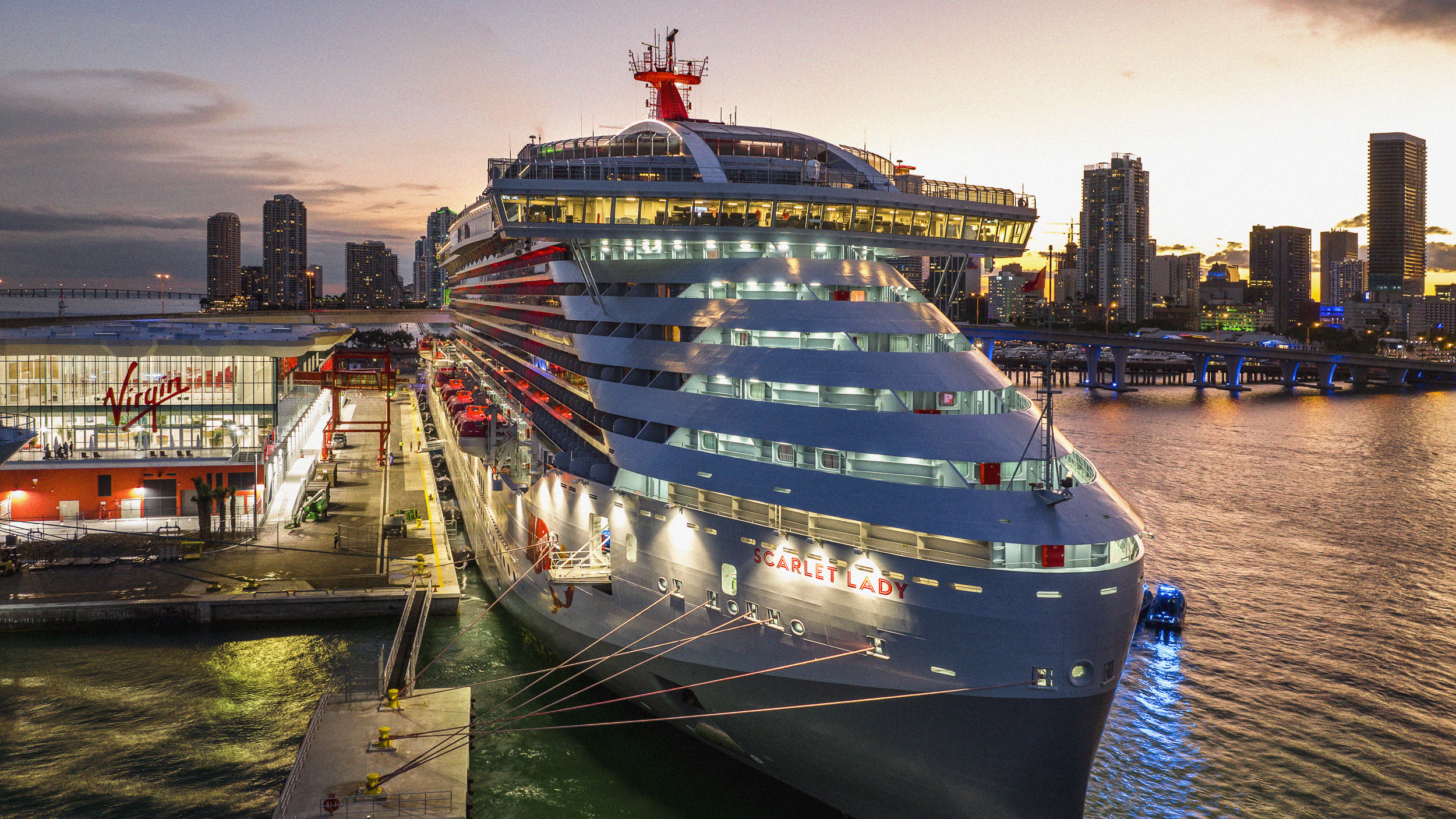 Excited first-time sailors boarding a Virgin Voyages ship on embarkation day