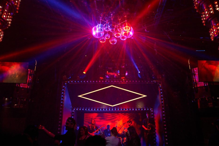Two-story nightclub The Manor with DJ and dance floor on Virgin Voyages