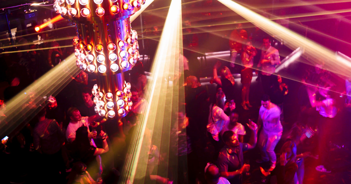 Two-story nightclub The Manor with DJ and dance floor on Virgin Voyages
