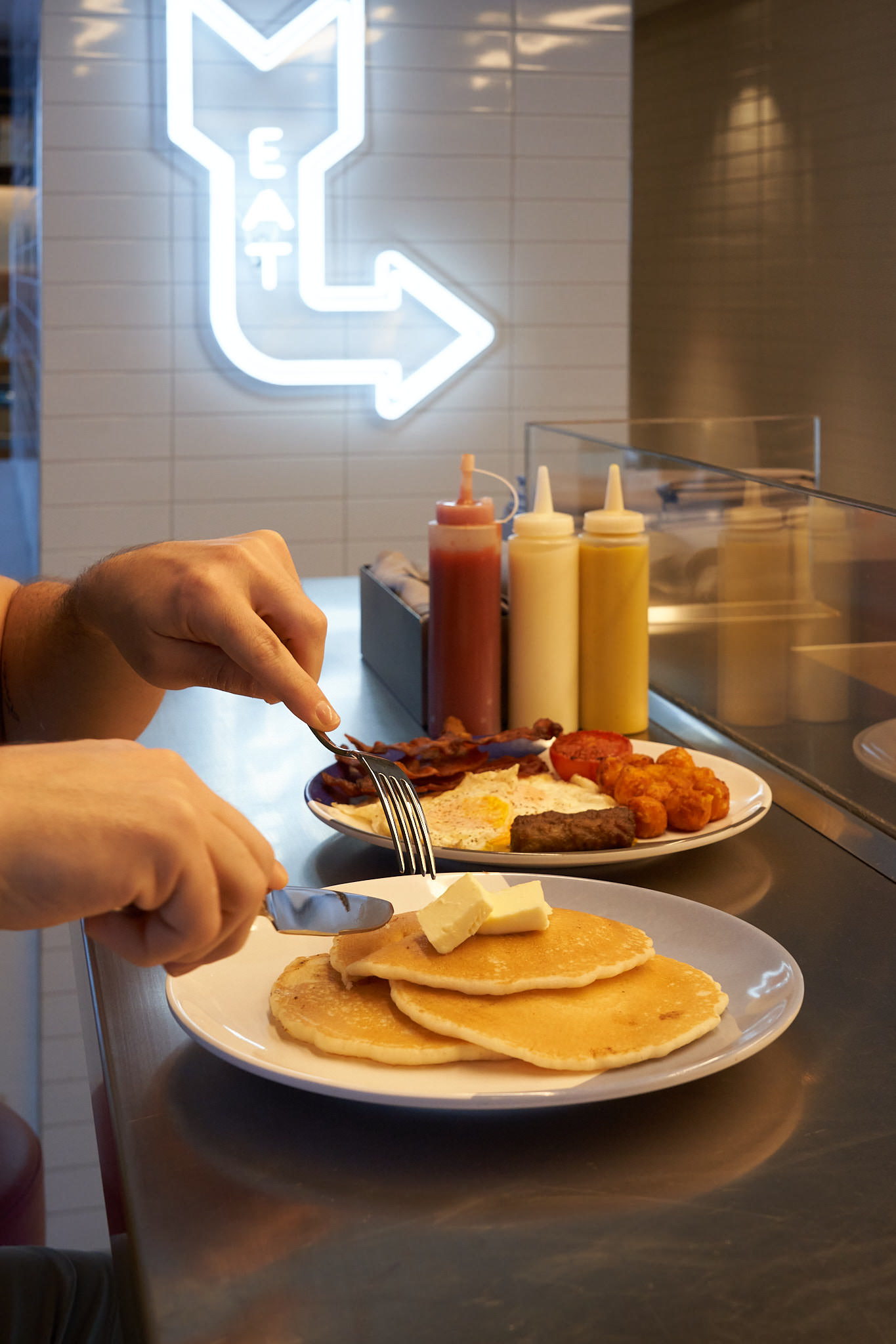 Brunch service at The Wake restaurant with ocean views on Virgin Voyages