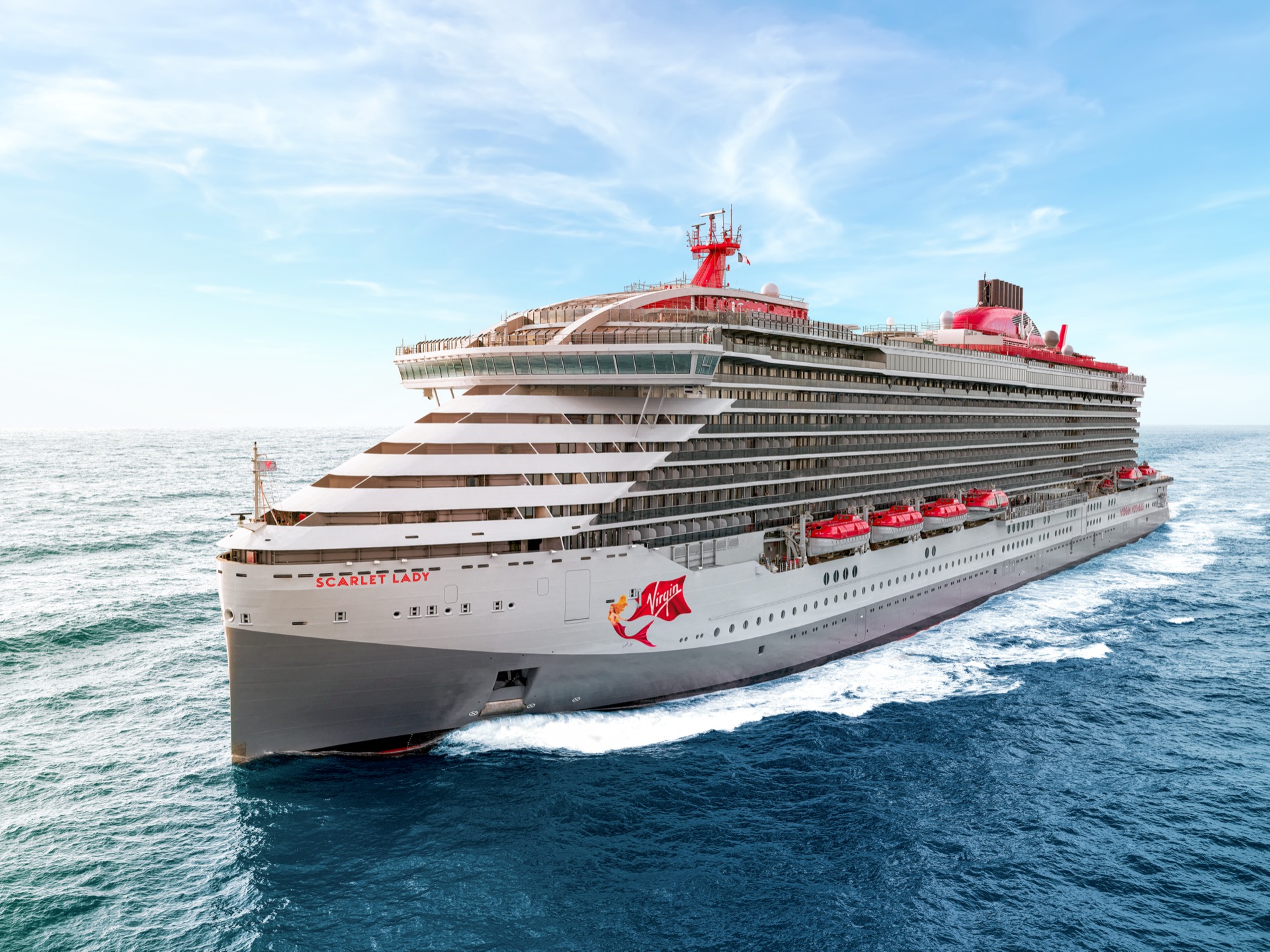 Virgin Voyages ship sailing at sea highlighting the importance of travel insurance