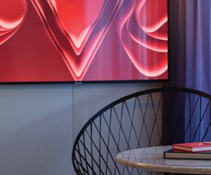 Sailor using the Virgin Voyages app to plan activities on their cruise