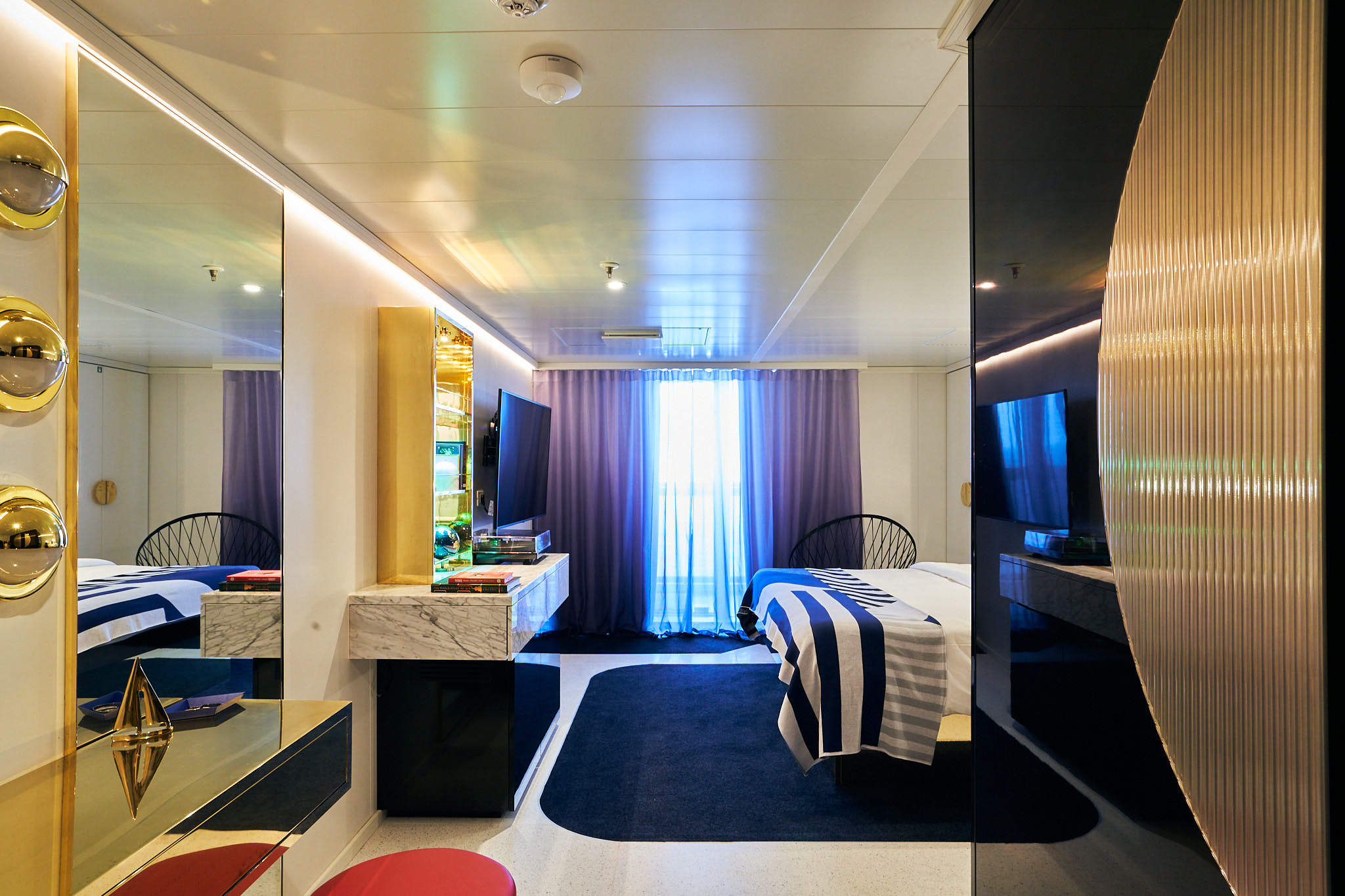 Sailor using the Virgin Voyages app to plan activities on their cruise