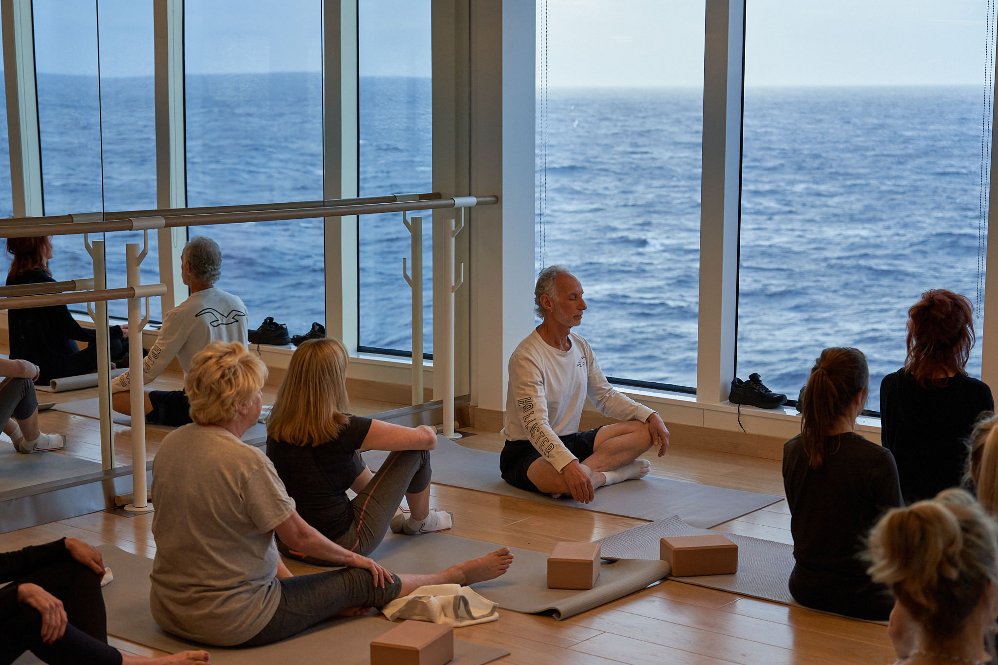 Yoga class on the outdoor deck at sunrise on Virgin Voyages